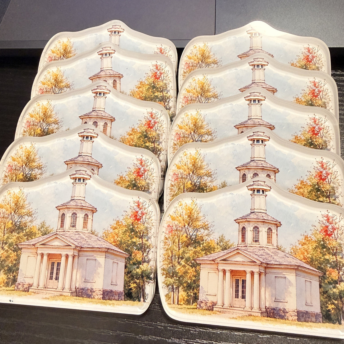 Custom-shaped autumn chapel acrylic wedding magnets arranged as a finished batch