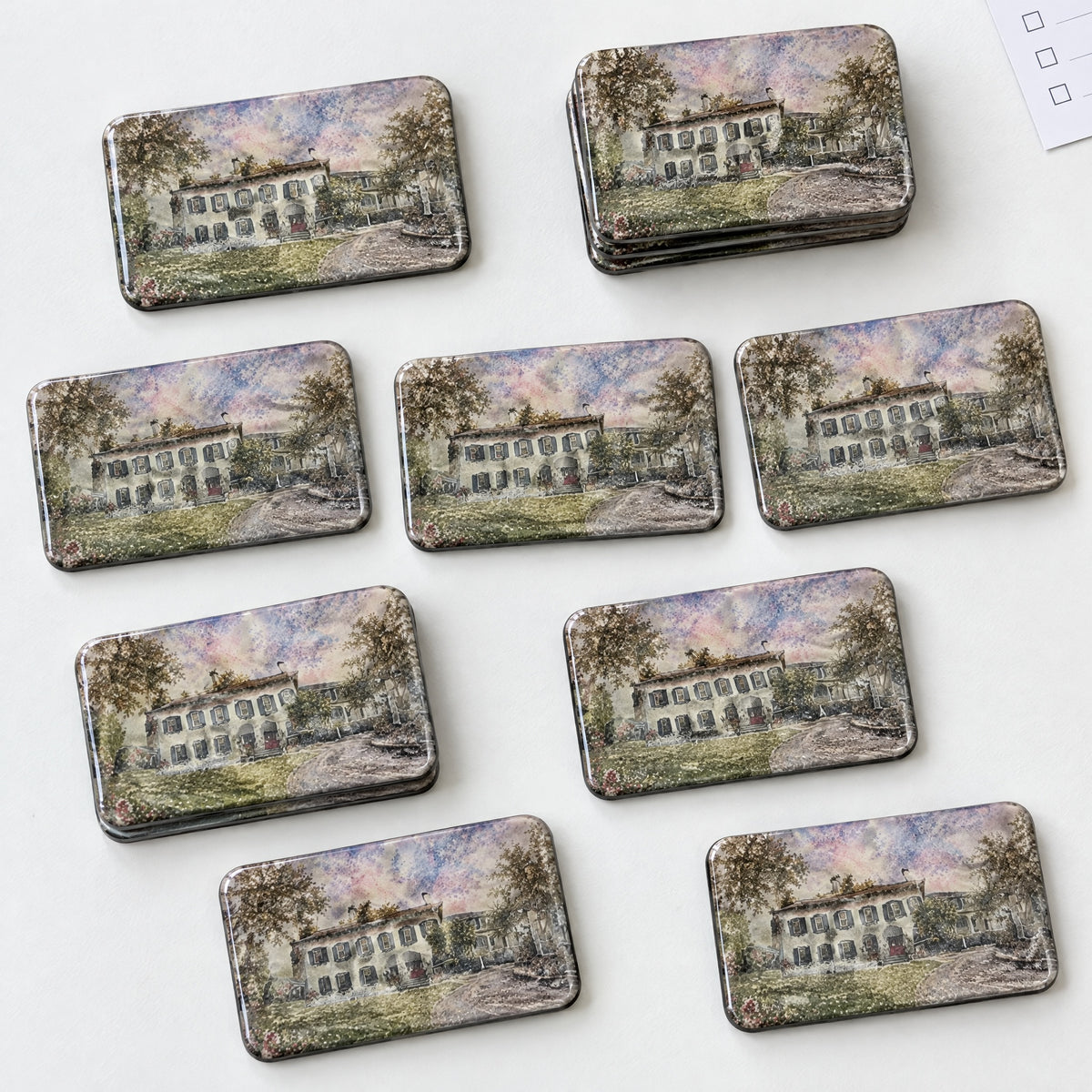 Rectangular manor watercolor acrylic wedding magnets arranged for quality inspection